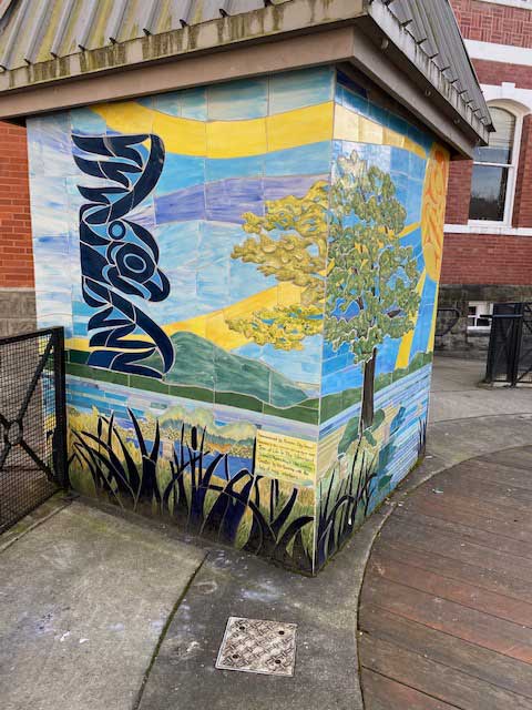 A public mural in Duncan, BC depicting sunshine